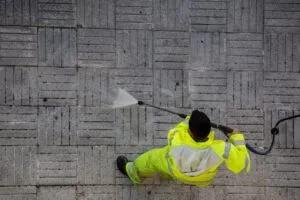 Worker Cleaning Street